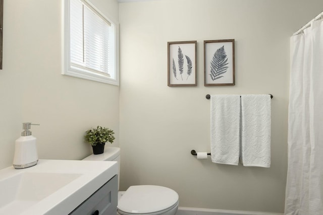 bathroom with vanity and toilet