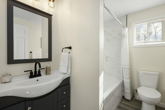 full bathroom featuring vanity, shower / tub combo with curtain, and toilet