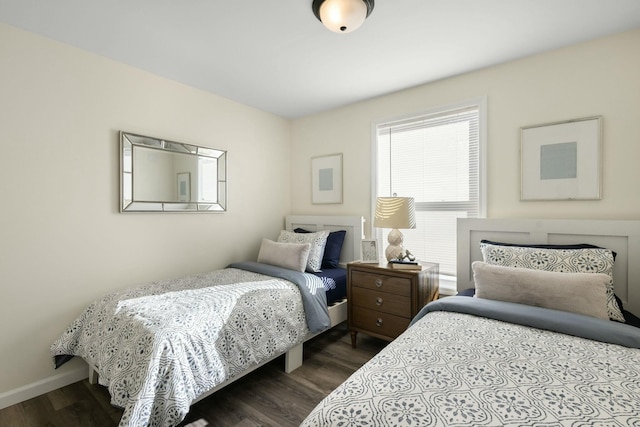 bedroom with dark wood-type flooring