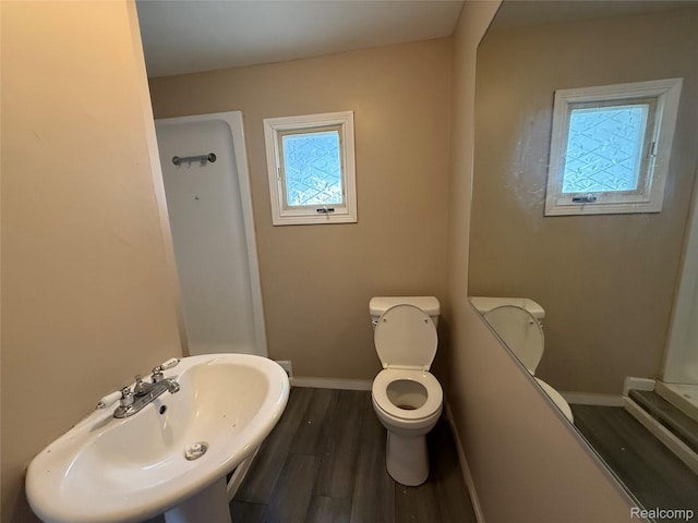 2372 E Boatfield Ave, Burton, MI 48529 - full bathroom featuring plenty of natural light and wood finished floors