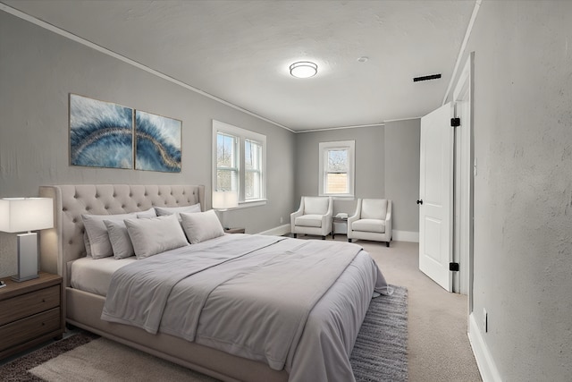 carpeted bedroom featuring crown molding