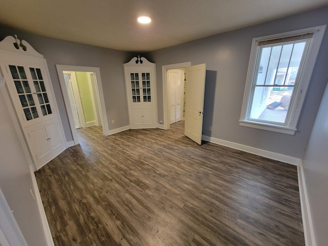 interior space with dark hardwood / wood-style flooring