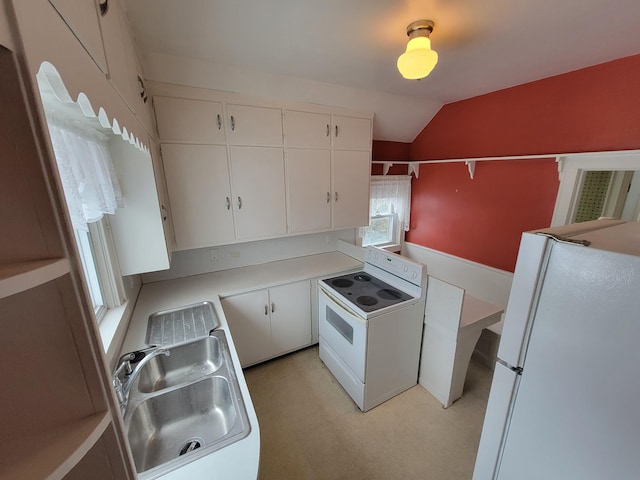 kitchen with lofted ceiling, sink, white cabinets, and white appliances