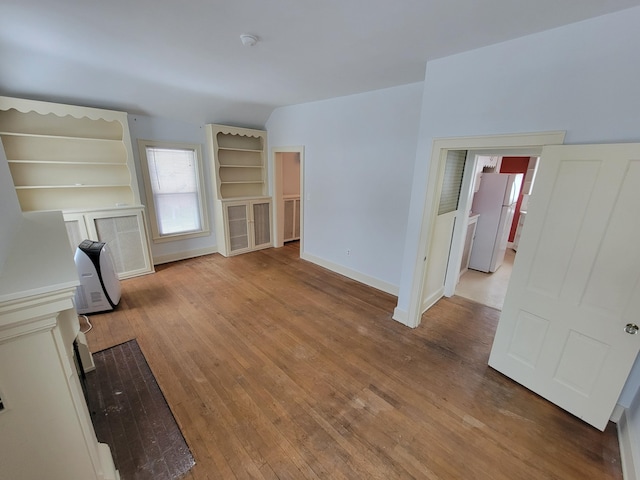 unfurnished living room featuring light wood-type flooring