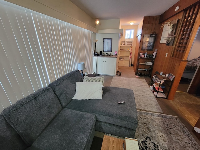 living room with wood walls