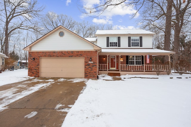 view of front of house with a porch and a garage