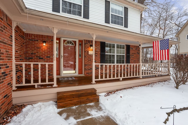 view of snow covered property entrance