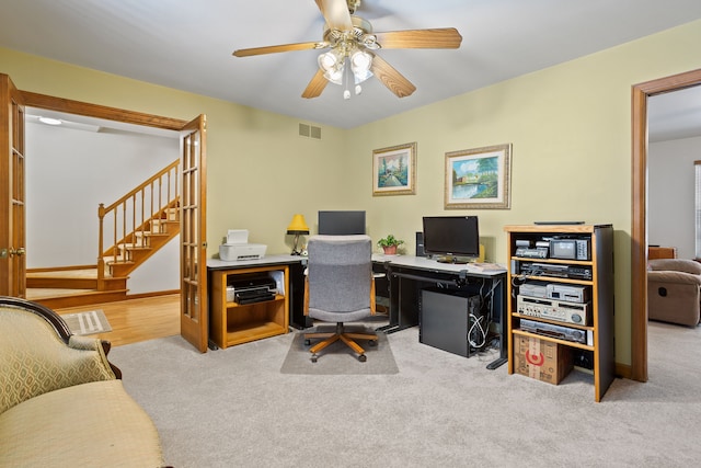 office area with light colored carpet and ceiling fan