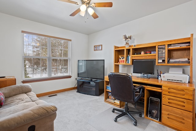 office space with light carpet and ceiling fan