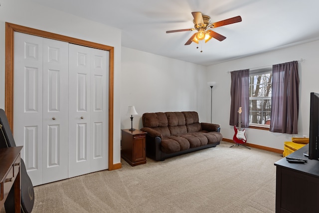 living room with light colored carpet and ceiling fan