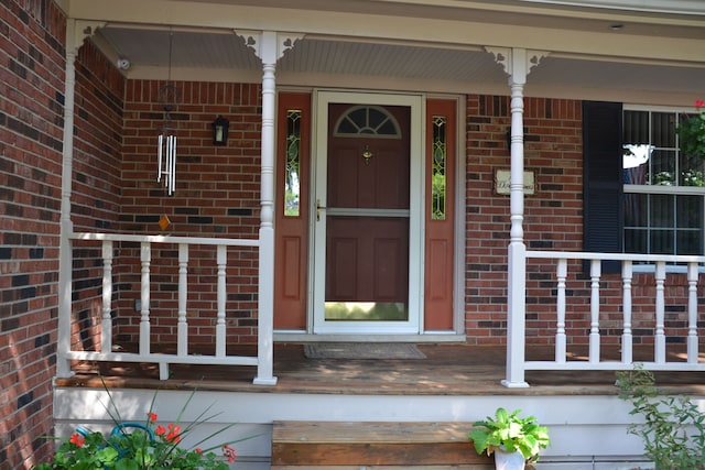 doorway to property featuring covered porch