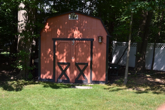 view of outdoor structure with a lawn