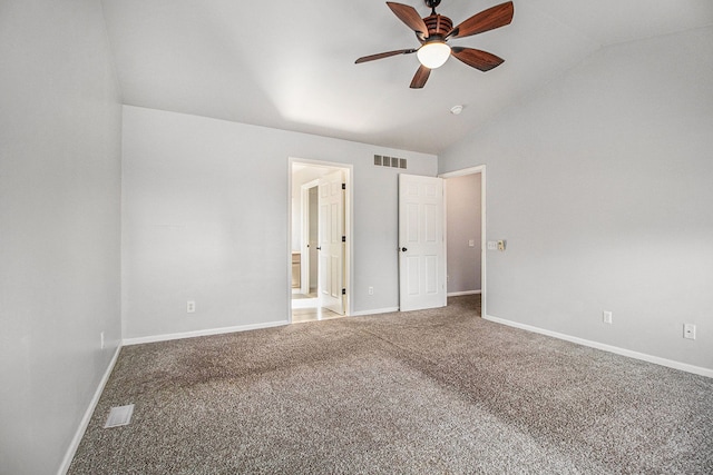 unfurnished room with lofted ceiling, ceiling fan, and carpet