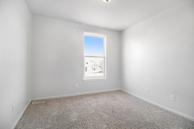 spare room featuring carpet