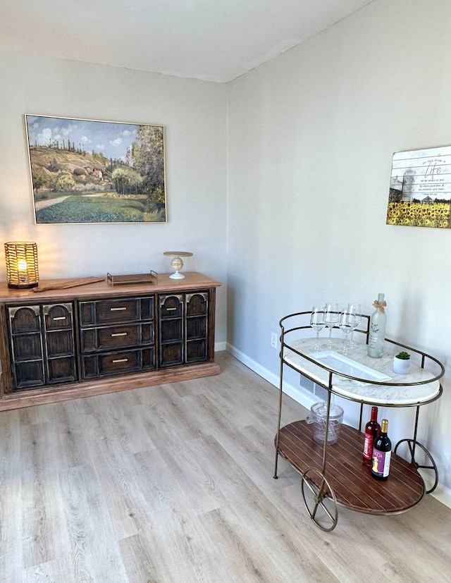 dining area with light hardwood / wood-style floors