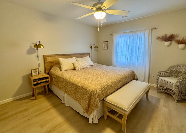 bedroom featuring hardwood / wood-style flooring and ceiling fan