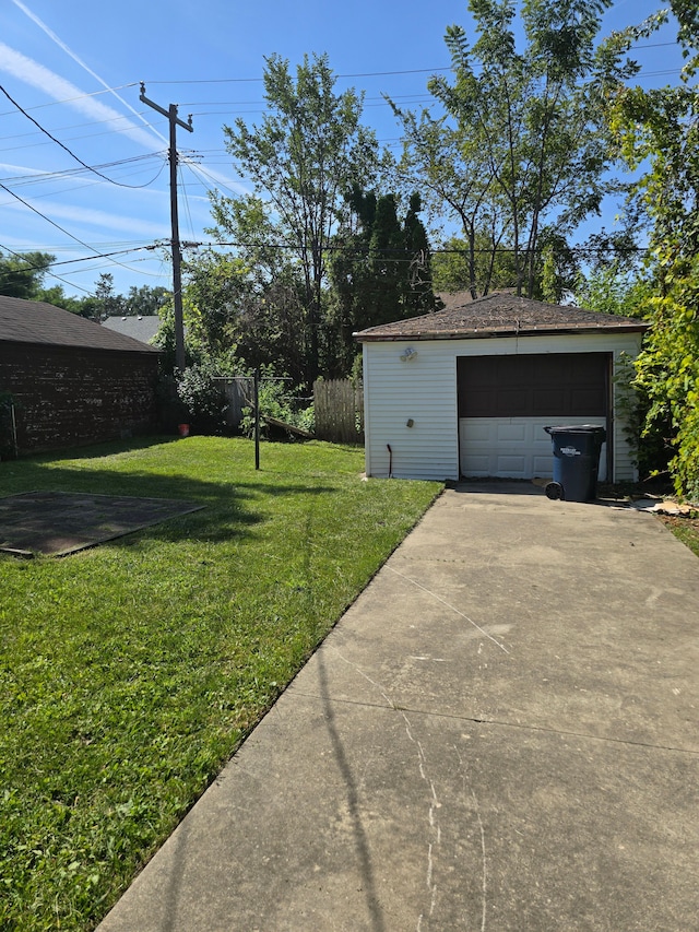 view of yard with an outbuilding and a garage