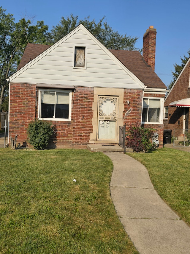 bungalow-style house with a front yard