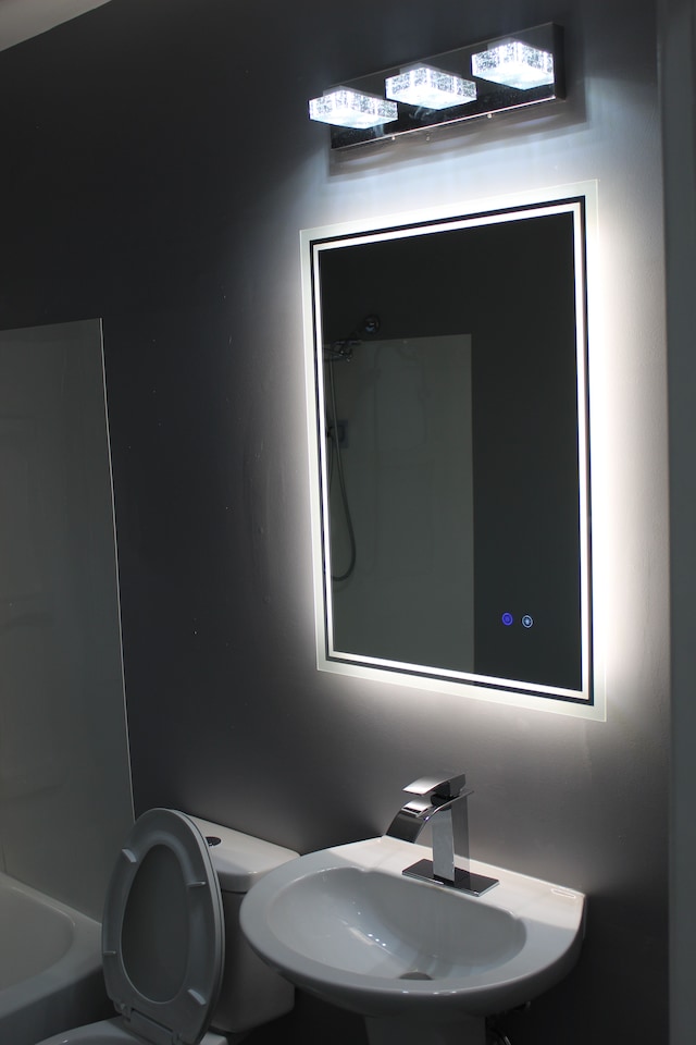 bathroom featuring sink and toilet