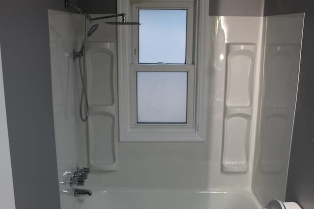 bathroom featuring washtub / shower combination