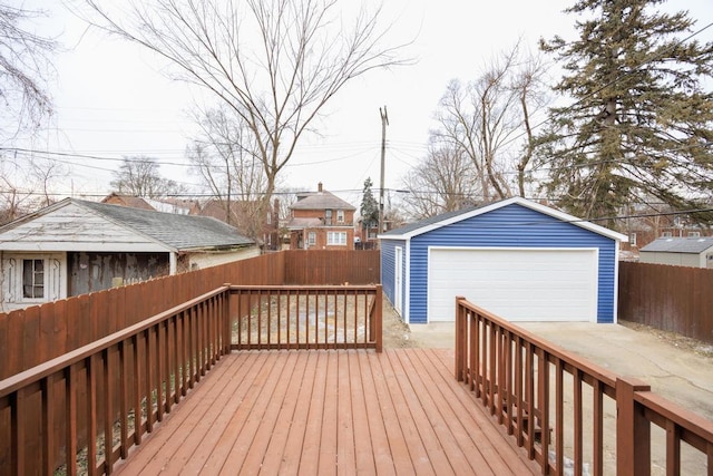 deck featuring a garage and an outdoor structure