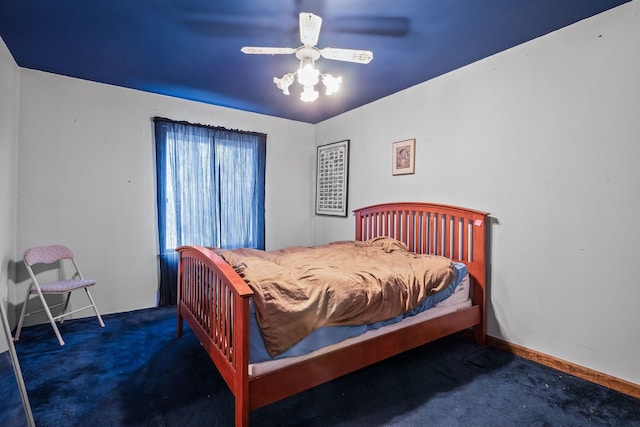 bedroom featuring dark carpet and ceiling fan