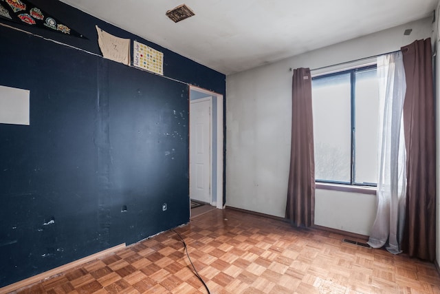 unfurnished room with light parquet floors