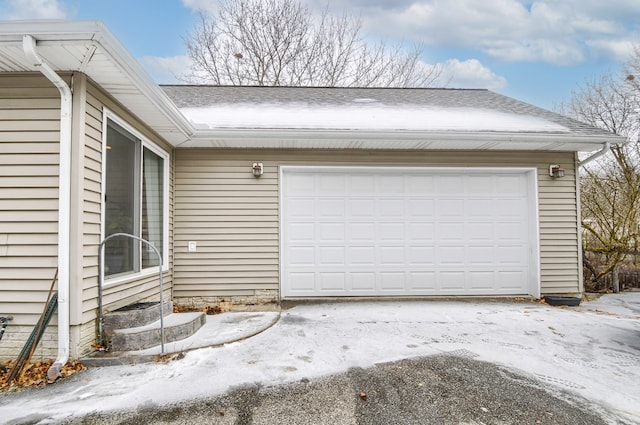 view of snow covered garage