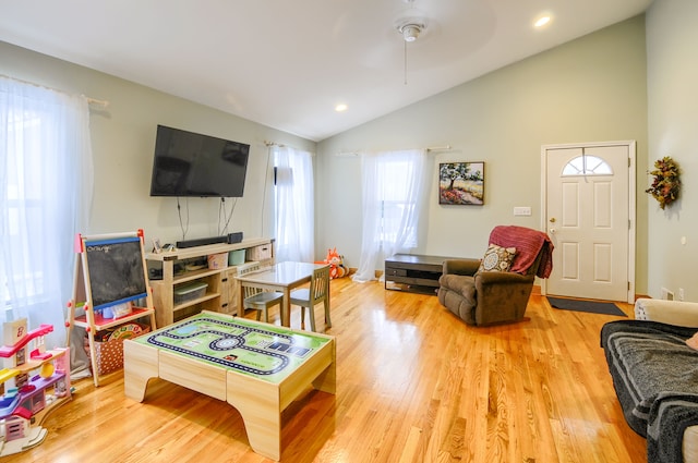 game room featuring vaulted ceiling and light hardwood / wood-style floors