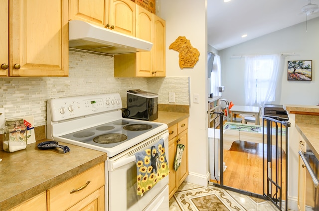 kitchen with vaulted ceiling, white electric stove, backsplash, light tile patterned floors, and light brown cabinets