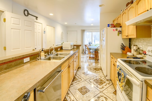 kitchen with sink, white appliances, light tile patterned floors, backsplash, and light brown cabinets