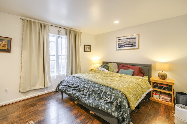 bedroom featuring dark hardwood / wood-style flooring