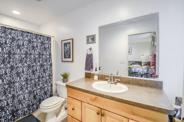 bathroom featuring vanity and toilet