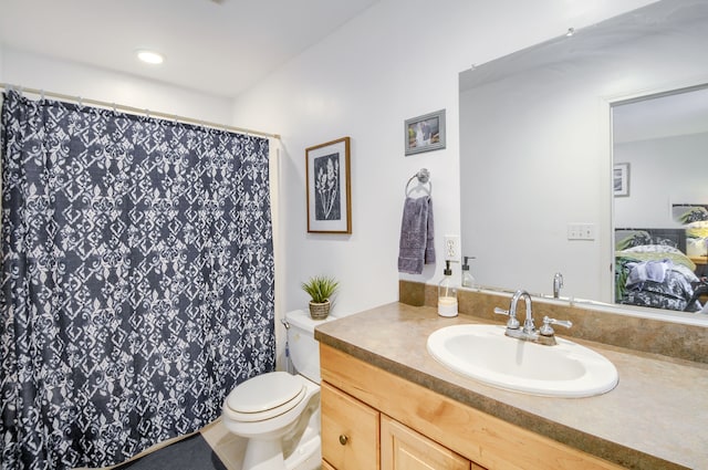 bathroom featuring vanity and toilet