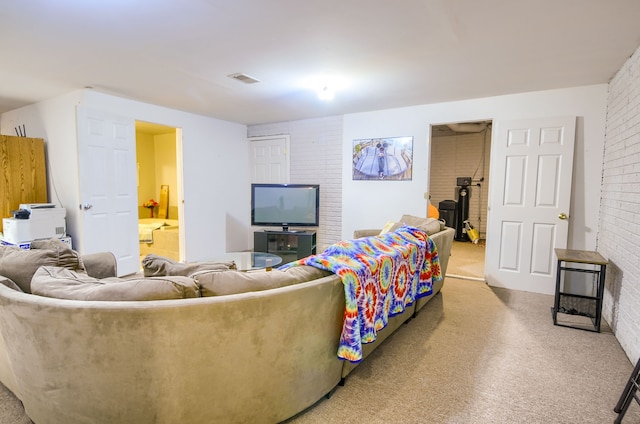 living room featuring brick wall