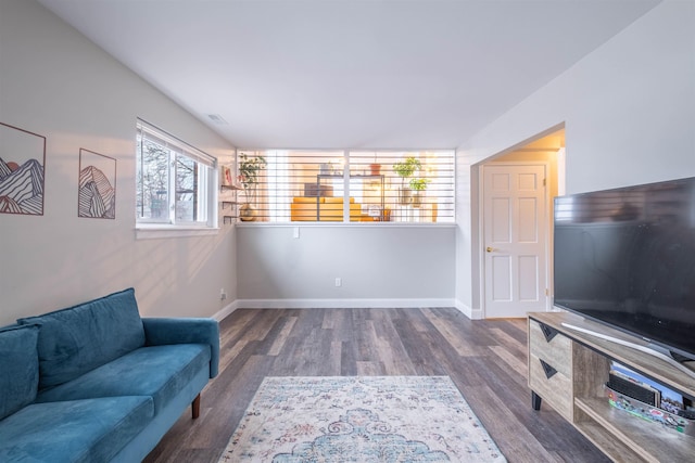 sitting room with dark hardwood / wood-style flooring