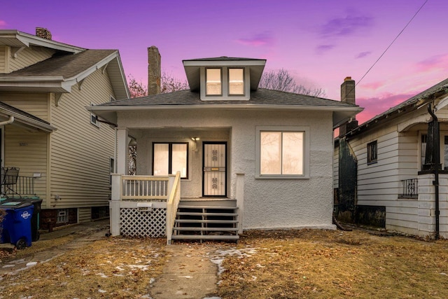 bungalow-style home with covered porch