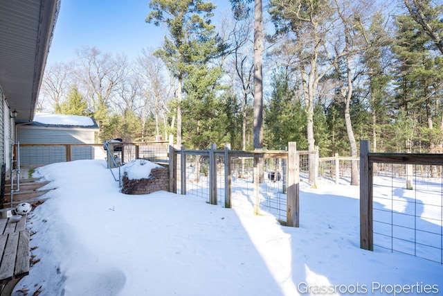 view of yard layered in snow