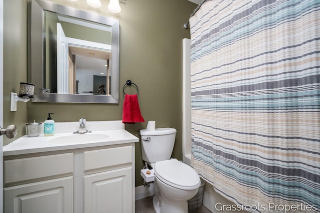 full bathroom featuring vanity, shower / bath combo, and toilet