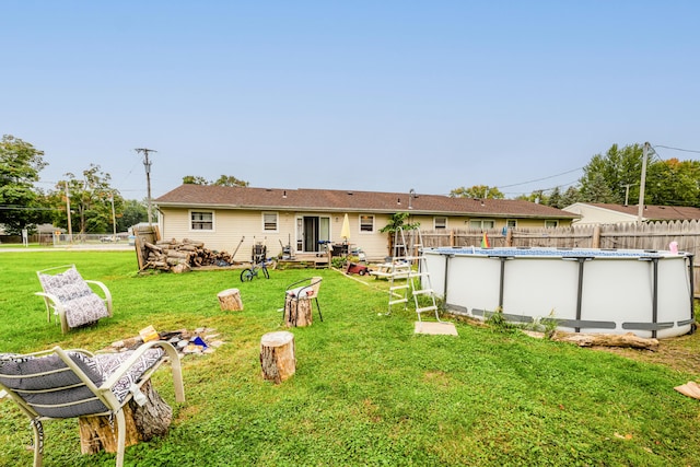 back of house with a lawn