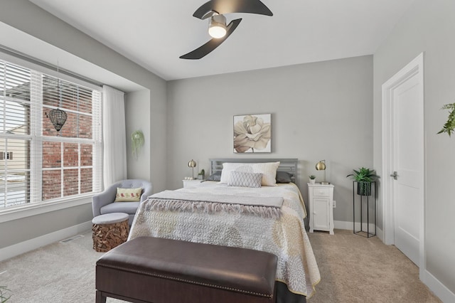 bedroom featuring light carpet and ceiling fan