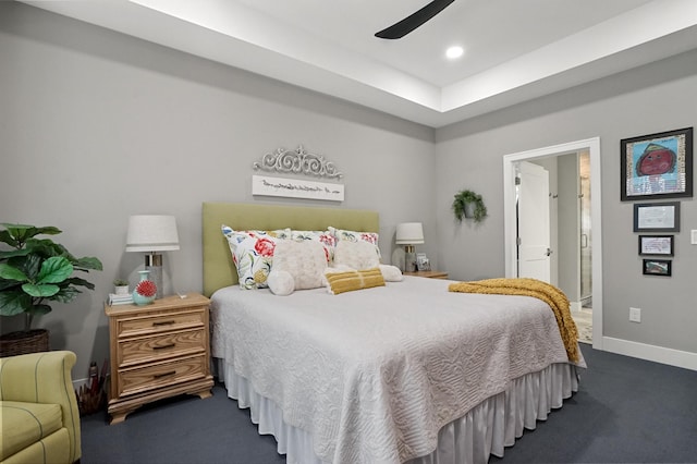 bedroom featuring ceiling fan and dark colored carpet