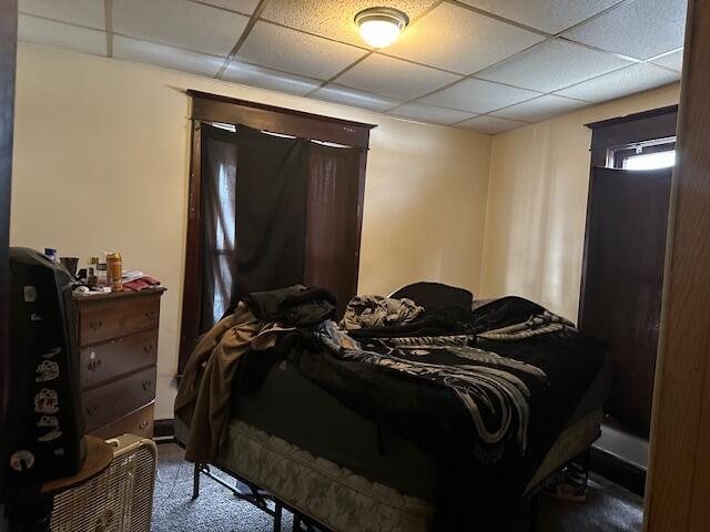 bedroom featuring a paneled ceiling