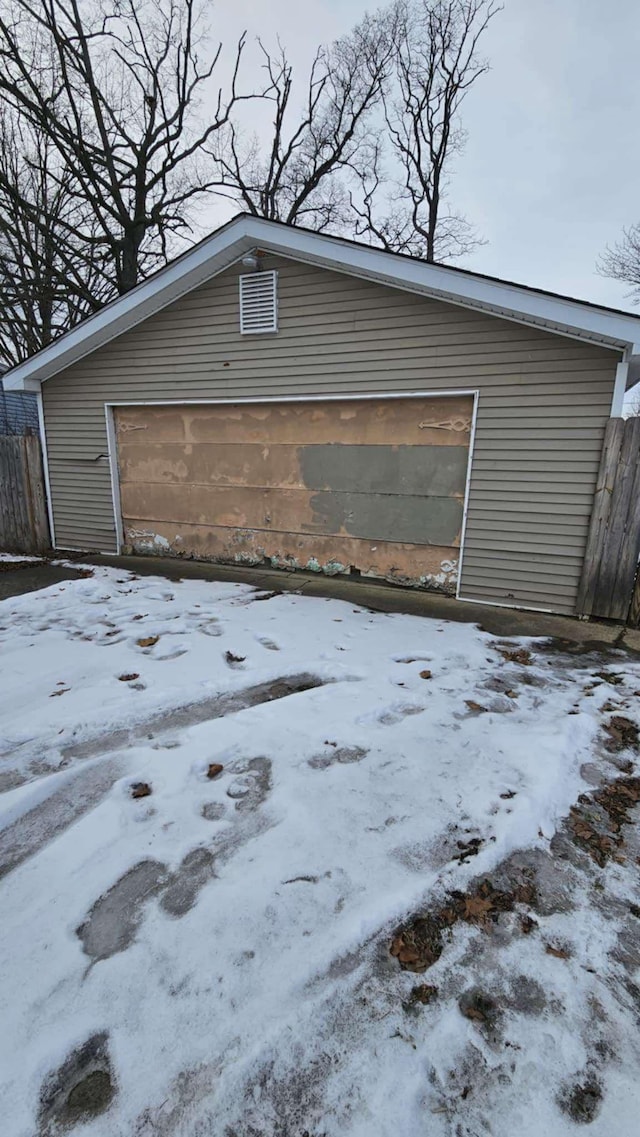 view of snow covered garage