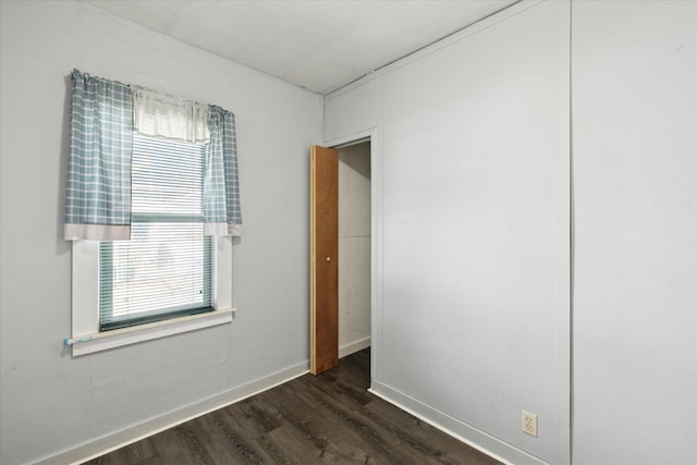 unfurnished room featuring dark hardwood / wood-style floors