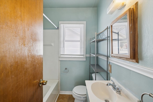 full bathroom with sink, shower / bathtub combination, and toilet