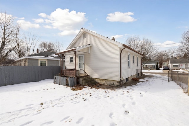 view of snow covered house