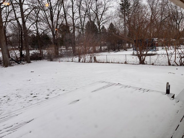 view of yard layered in snow