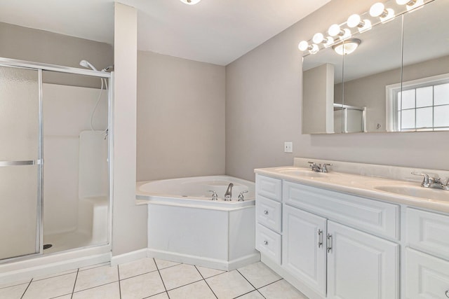 bathroom with tile patterned flooring, vanity, and separate shower and tub