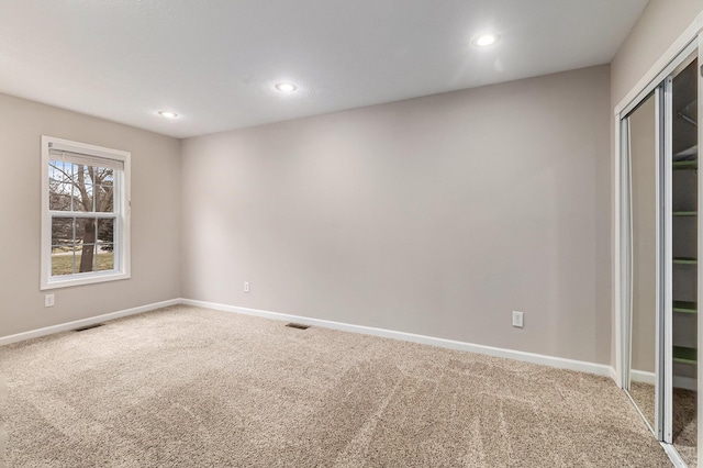 view of carpeted spare room